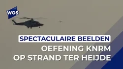 Helicopter hoists KNRM crew from the sea during exercise at Ter Heijde