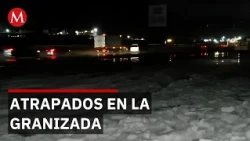 Hailstorm surprises drivers in La Marquesa; children play on piles of ice