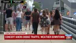 Concert goers dodge traffic, weather downtown