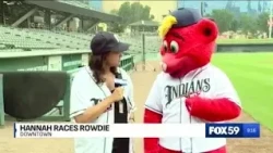 Reporter Hannah Follman challenges Rowdie to a race for Victory Field's 30th anniversary
