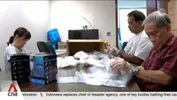 A hive of activity at CCs as residents collect free masks, seek respite in haze shelters