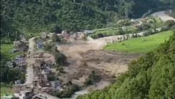 Families await news of thousands missing after Nepal-China flood