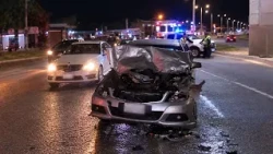 Driver survives crash into broken-down bus