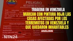 Houses affected by earthquakes in Venezuela marked with red paint as uninhabitable